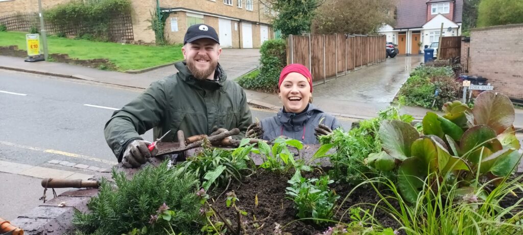 Two of our Green Force champions planting flowers at a local London train station in collaboration with local social enterprise. 
