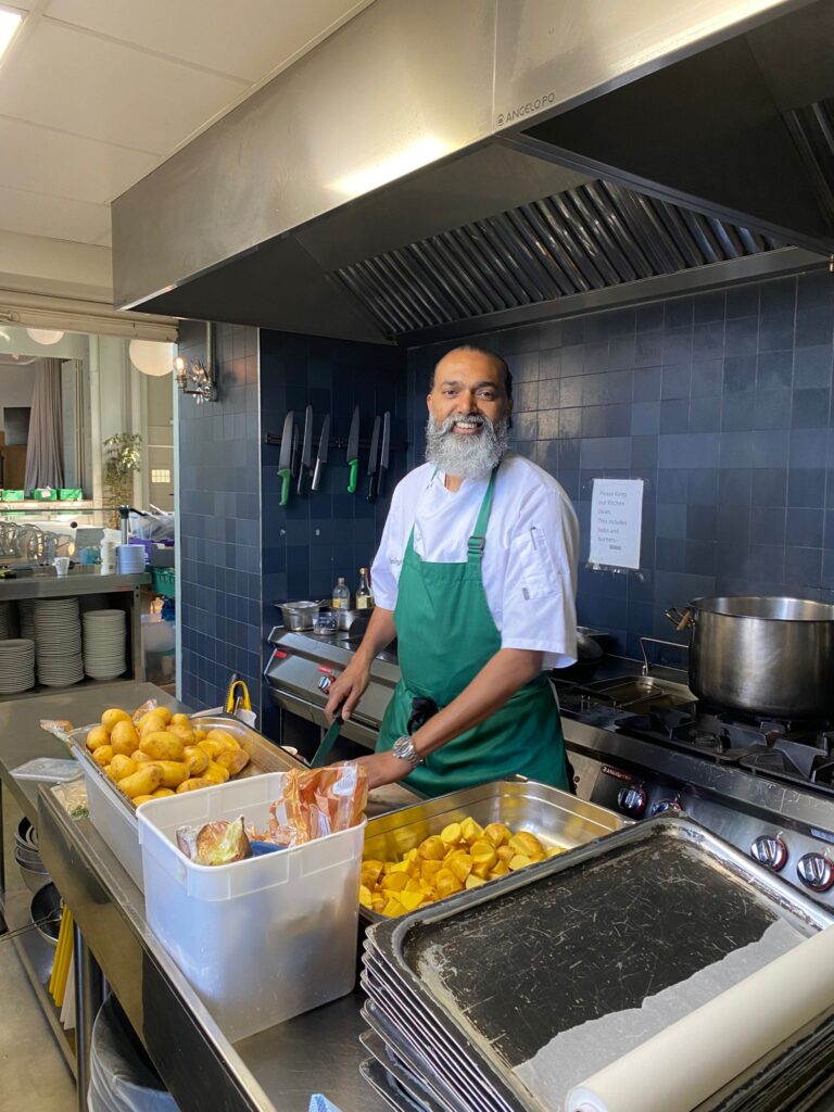 Our chef preparing the potatoes in the kitchen 